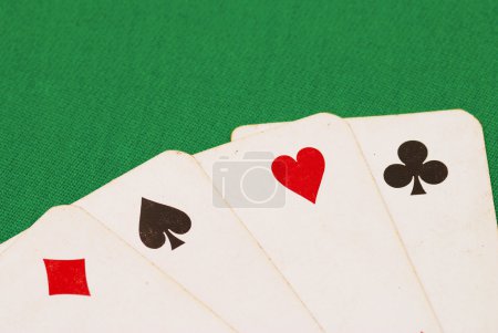 Four old playing cards