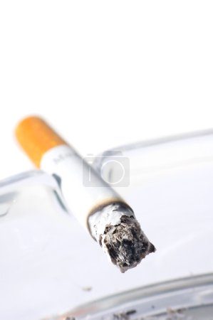Cigarette in ash tray with shallow DOF