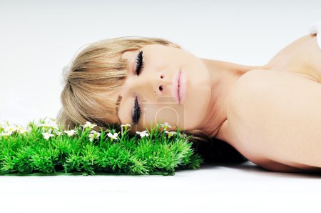 Woman face on grass
