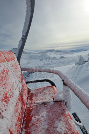 Ski lift, winter landscape in background