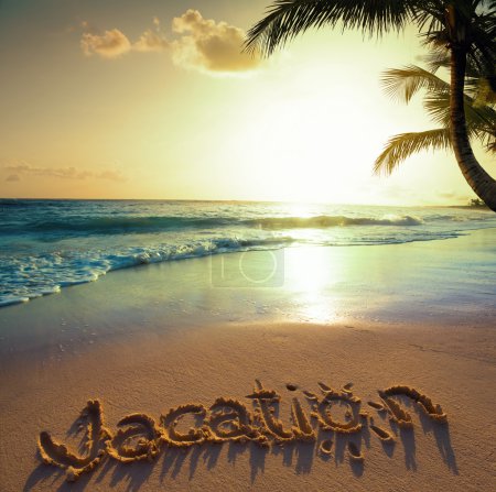Art Summer vacation concept--vacation text on a sandy ocean beac