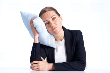 Businesswoman with pillow