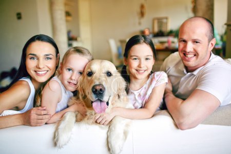 Family of four with pet
