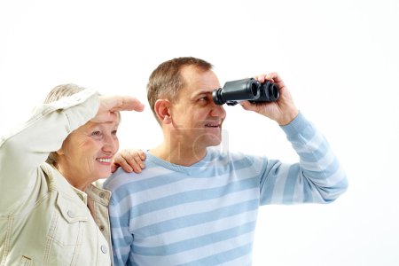 Senior couple with binoculars