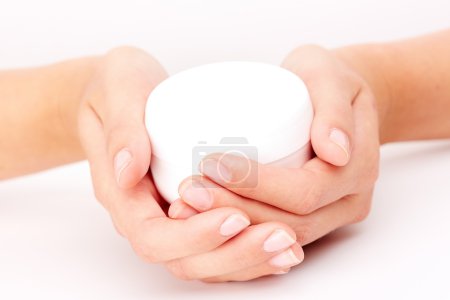 Hands holding cream