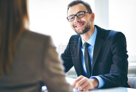 Businessman interviewing female