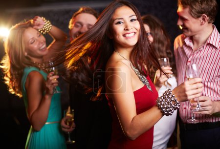 Cheerful girl with champagne flute