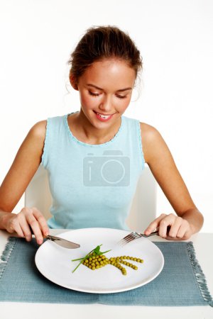 Girl ready to eat peas and leeks