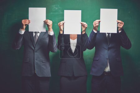 Business partners holding blank papers