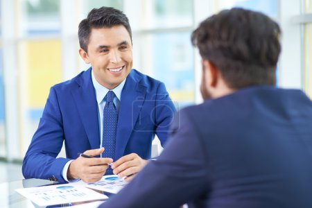 Businessman with colleague at meeting