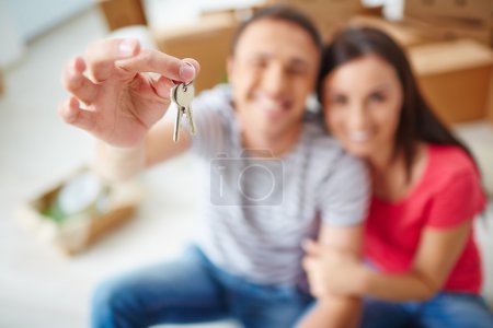 Man showing keys from new flat