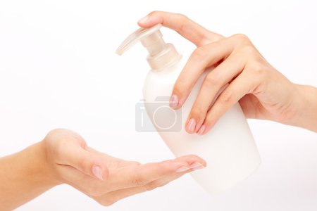 Hands pumping liquid soap