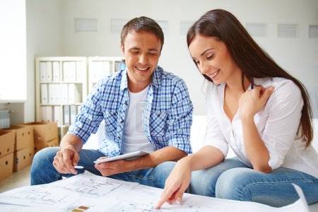 Couple during discussion of plan of flat