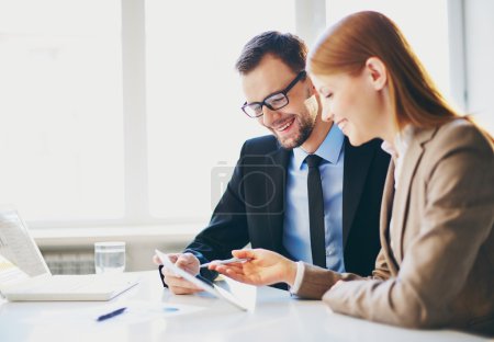 Business partners using touchpad