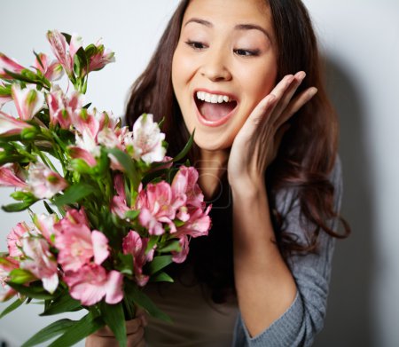 Ecstatic woman with flowers