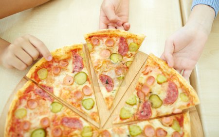 Children taking pizza