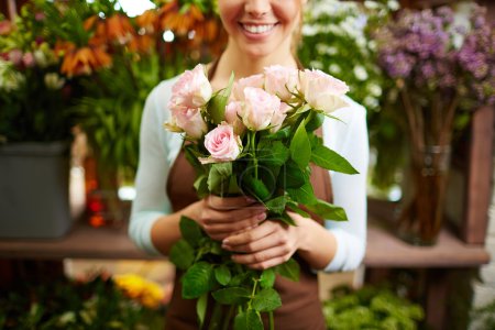 Female holding bunch of roses