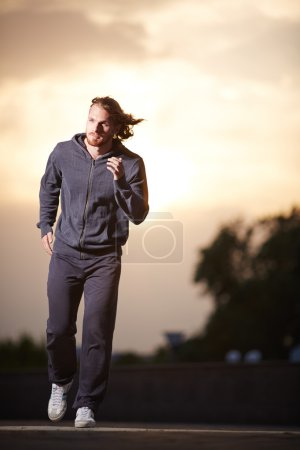 Sportsman running in the evening