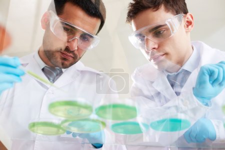 Clinicians analyzing liquids