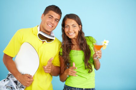 Couple with cocktail and skateboard