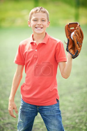 Boy with caught baseball
