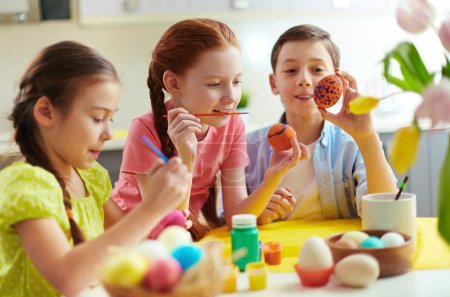 Preschoolers decorating Easter eggs