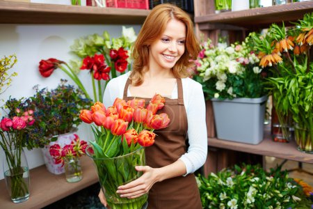 Woman florist with red tulips
