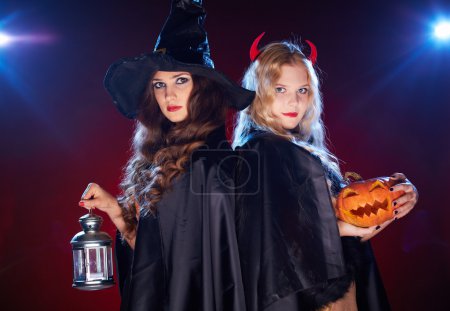Females with lantern and pumpkin