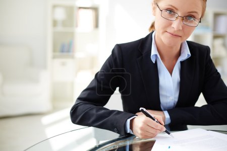 Businesswoman signing contract