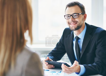 Businessman interviewing female