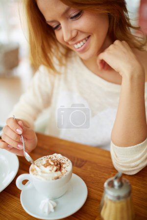 Woman having dessert in cafe