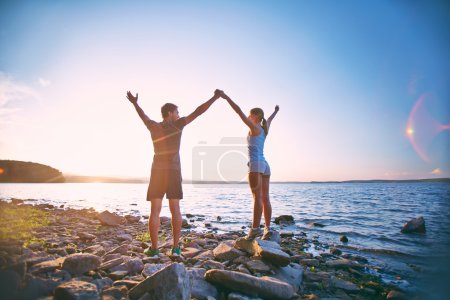 Couple standing on coastline