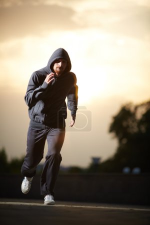 Sportsman running in the evening