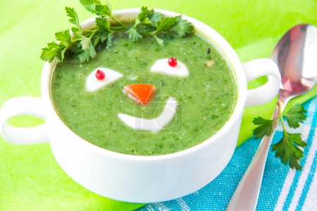 Funny healthy soup with spinach for children