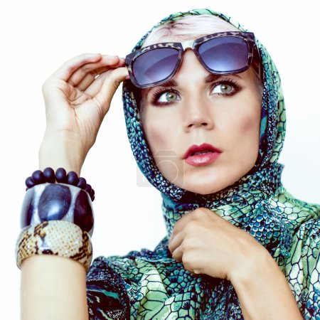 Portrait of sensual woman in a scarf and glasses