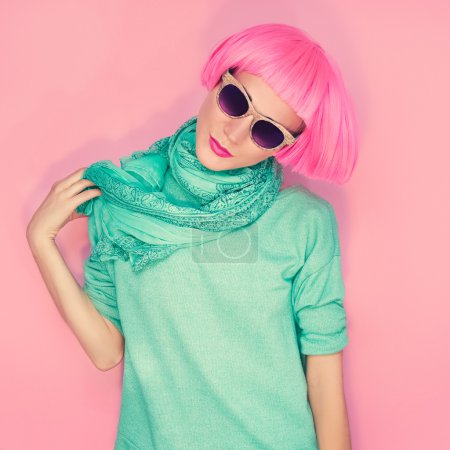 Fashion glamor girl on a pink background wall. urban style