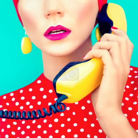 Close-up portrait of a retro girl with telephone