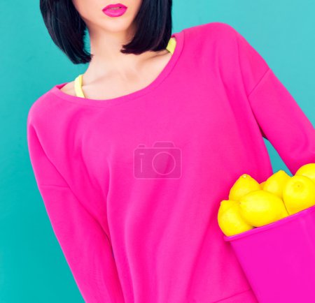 glamor portrait of a girl with lemons