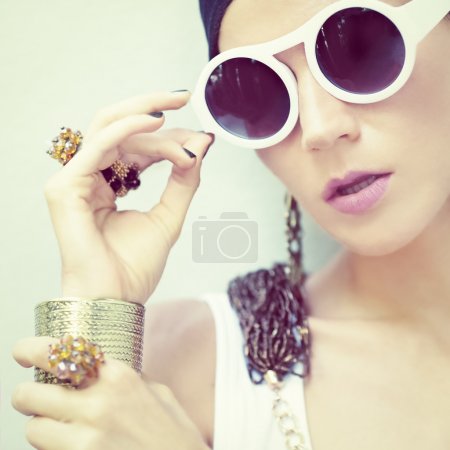 portrait of a stylish girl in jewelry and accessories