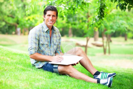 Young student with note at outdoor