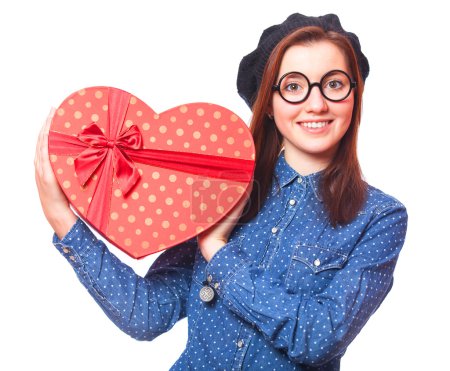 Nerd girl in glasses with heart shape gift.