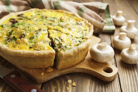 Pie with mushrooms, chicken and herbs