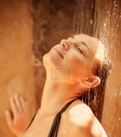 Cute girl taking shower
