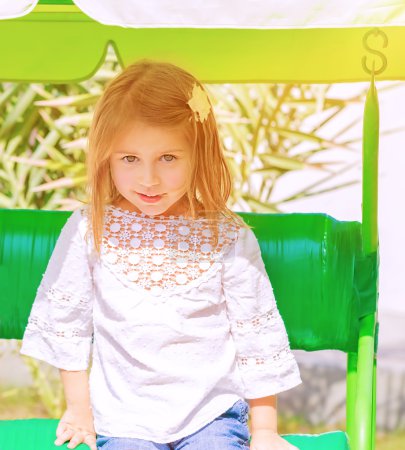 Little girl on swing