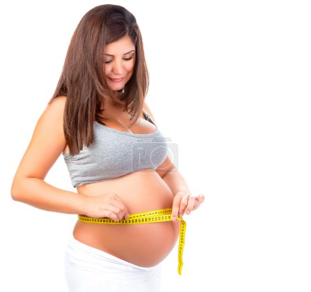 Pregnant woman measuring belly