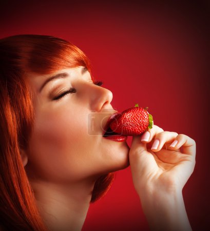 Seductive female with strawberry