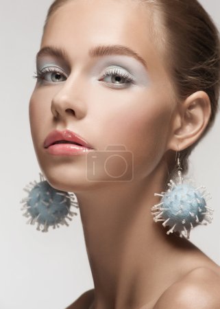 Beautiful woman with fancy earrings
