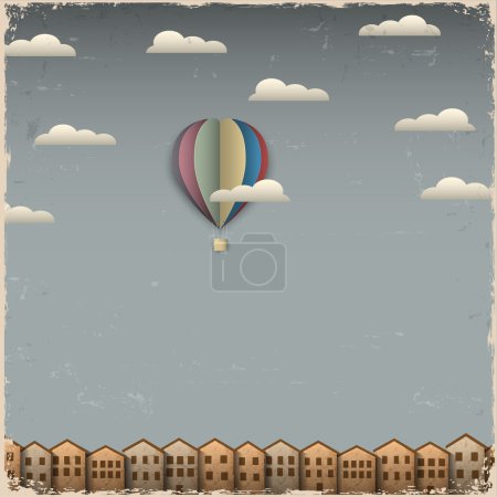 Retro hot air balloon and town from paper