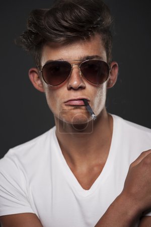 Man with cigarette between lips