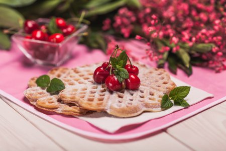 Sweet waffles with cherries